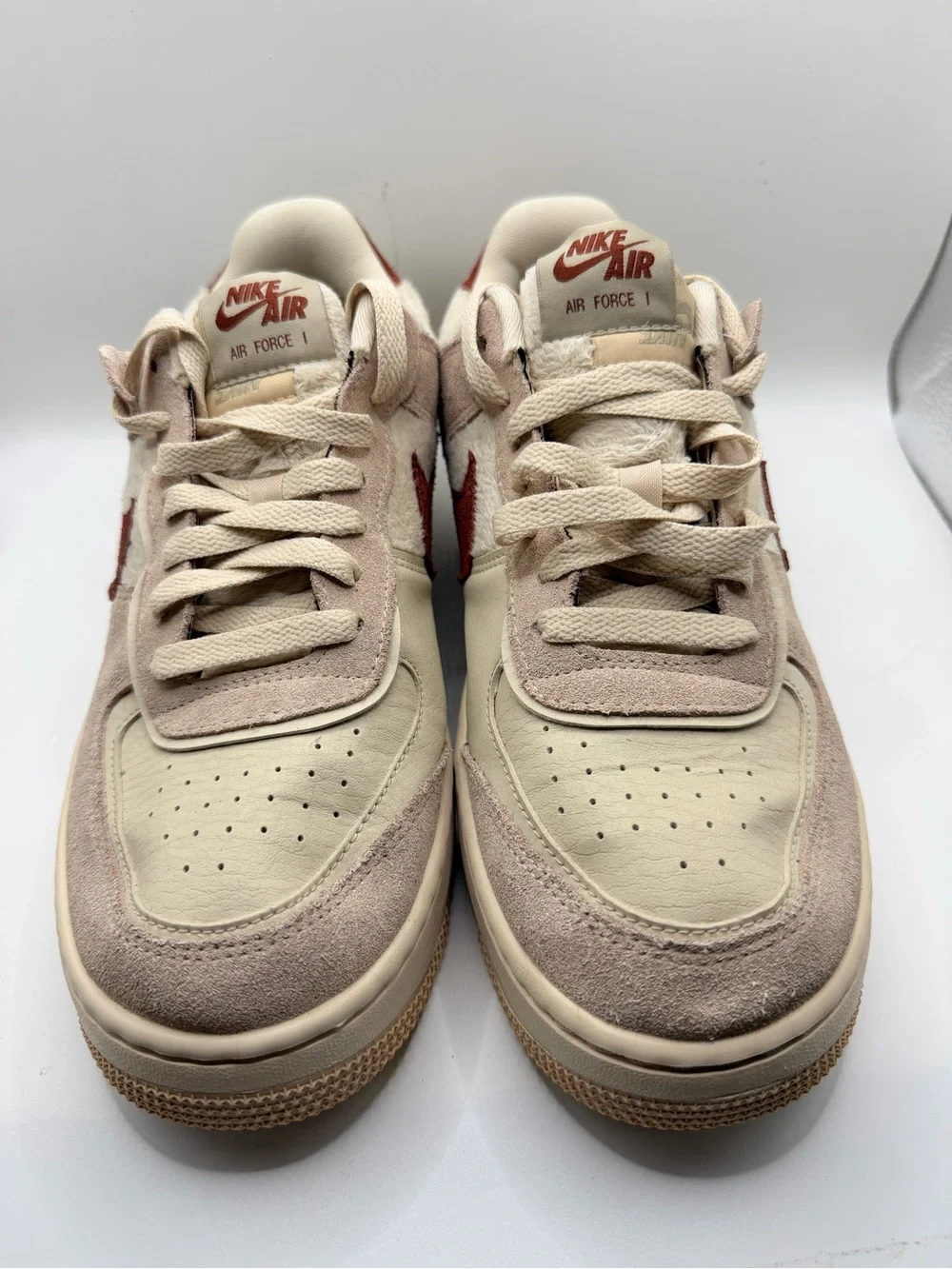 Nike Women's Low-Top Sneakers in Cream with Rust Swoosh